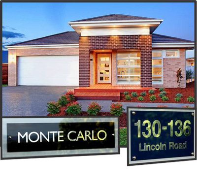 Modern brick home at twilight featuring a Polished Glass house plaque and address glass house sign
