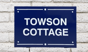 Blue and silver painted house sign with custom name and number, handcrafted in Australia